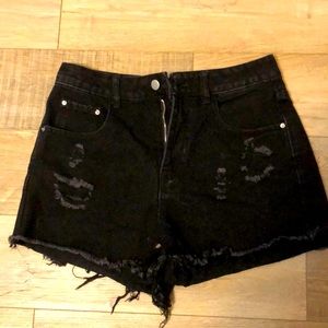 Medium-large ripped black denim shorts